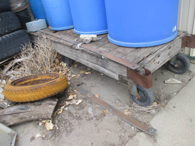 lot 102 image: Material Cart on Wheels, Tires, 55 gal Plastic Drums