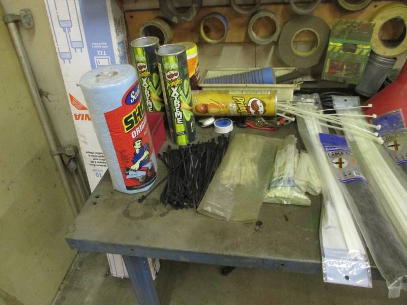 lot 26 image: Shop Table  Contents of Wall  2 Cabinets