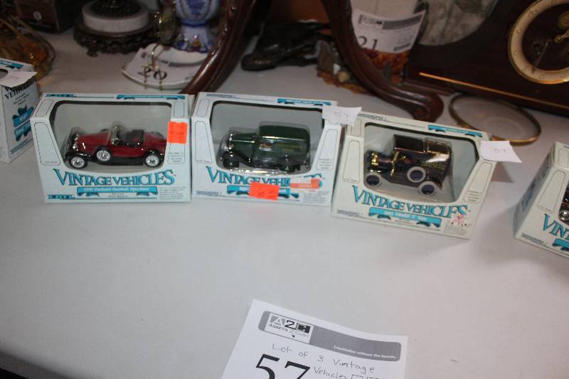 lot 57 image: Lot of (3) Vintage Vehicle Scale Die-cast Model Cars - 1930 Packard Boattail Speedster, 1932 Ford Panel Truck, 1913 Model T Van