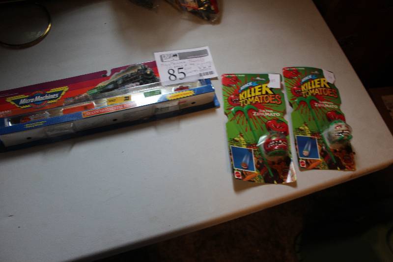 lot 85 image: Lot of (3) Toys Includes 2) Attack of the Killer Tomatoes, 1) Micro Machines Transcontinental Freight Train