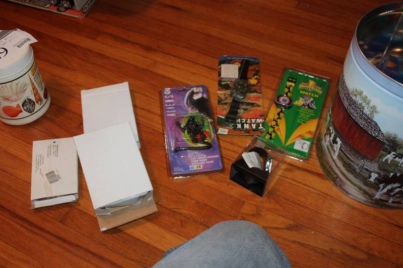 lot 428 image: Milk Can of Watches, Movie Collectibles - Toy Story 2, Aliens, Tank, And More