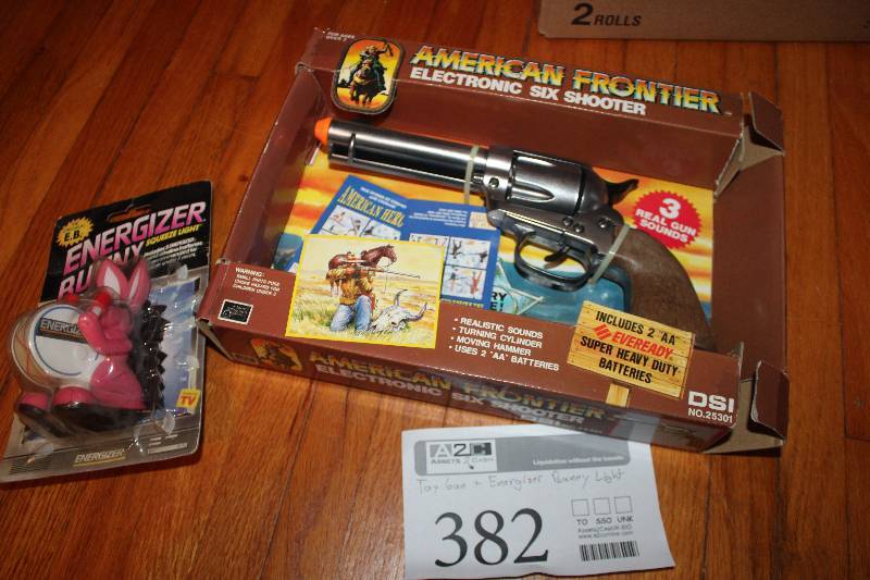 lot 382 image: Lot of (2) Toys - American Frontier Electronic 6-shooter Gun, Energizer Bunny Light