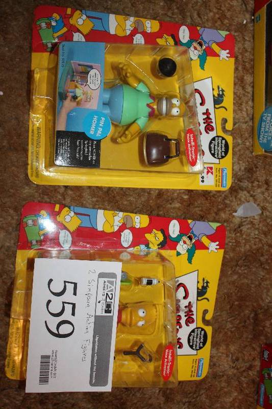lot 559 image: Lot of (2) The Simpsons Action Figure Sets - Homer, Bart