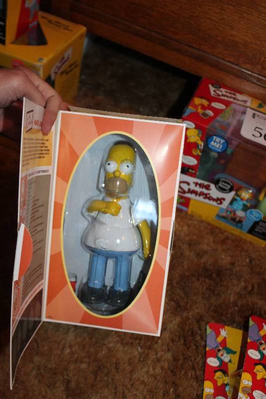 lot 555 image: The Simpsons Homer Tin Action Toy