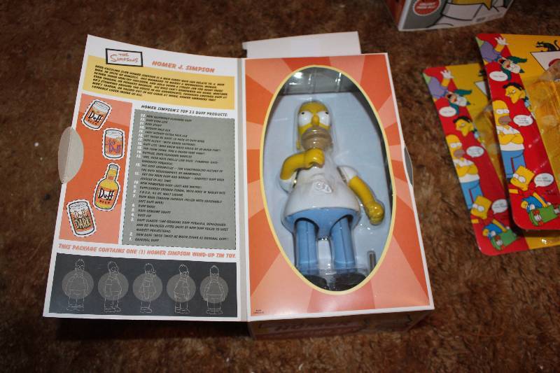 lot 556 image: The Simpsons Homer Tin Action Toy