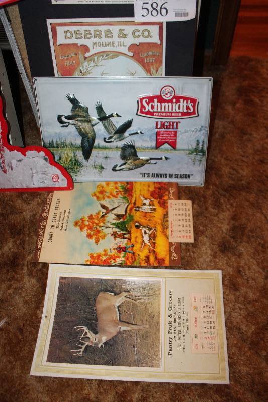lot 586 image: Lot of (4) Wall Decorations - 2) 1975 Wall Calendars, 1) Schmidt Beer Sign, 1) Deere & Co. Sign