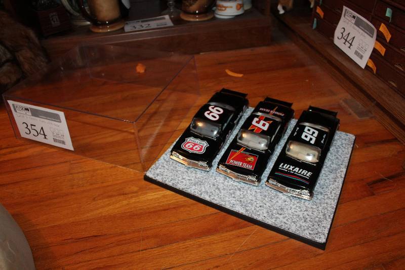 lot 354 image: Lot of (3) 118 NASCAR Cars in Display Case