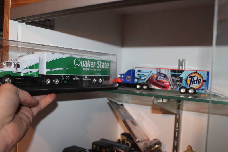 lot 391 image: Lot of (2) Toy Semi Tractor Trailers - Quaker State, Tide
