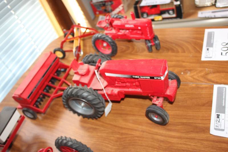 lot 597 image: Farm Master 8750 Toy Tractor w Pull-Behind Farm Implement
