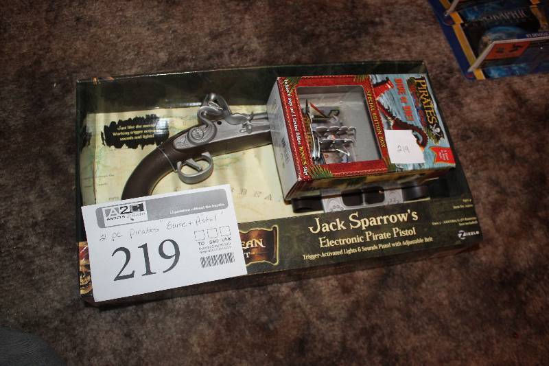 lot 219 image: Pirates Of The Carribean Action Toys - Electronic Pirate Pistol & Game w Ships