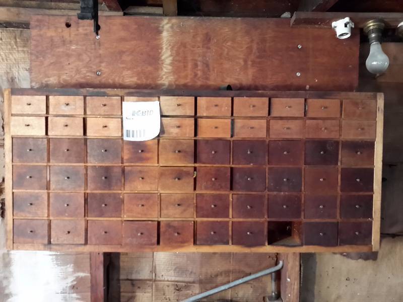 lot 110 image: Wall cabinet of small wood boxes..  (1 missing)
