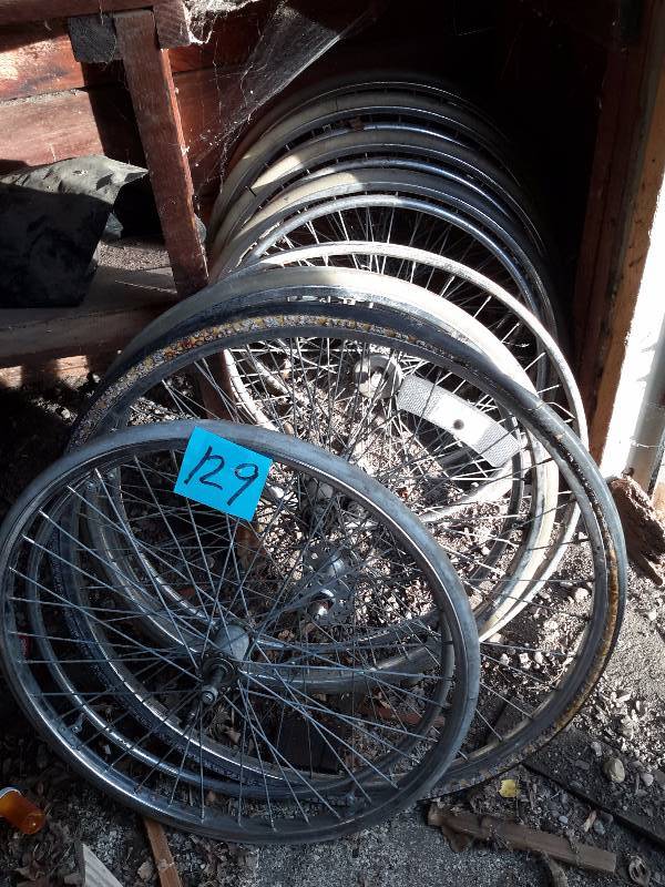 lot 129 image: 6, wheel chair wheels and 2 bike wheels