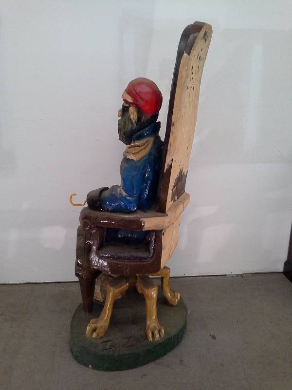 lot 704 image: Wooden Seated Pirate Sculpture