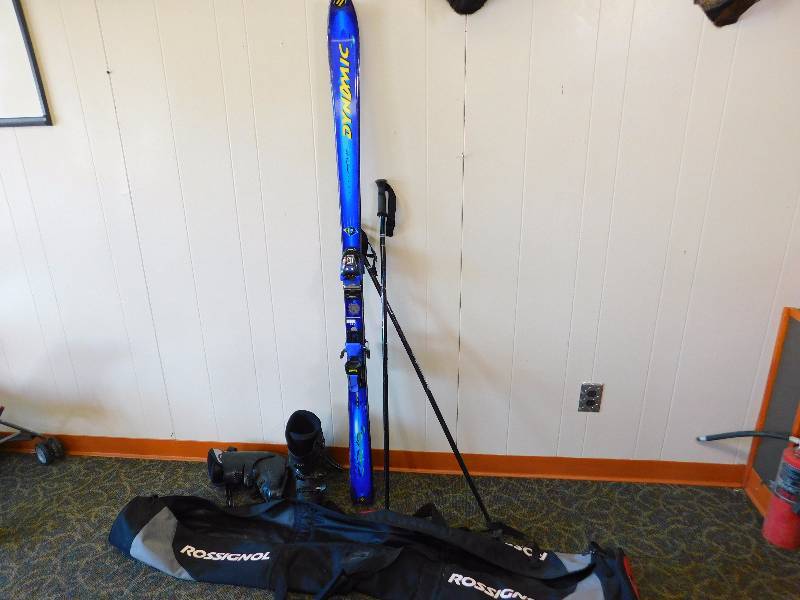 Skis, Poles, Ski Boots, and Carrying Bag