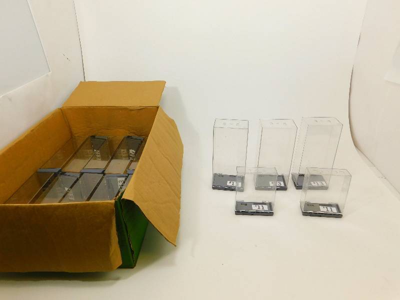 Clear Security Boxes and Pair of Headphones