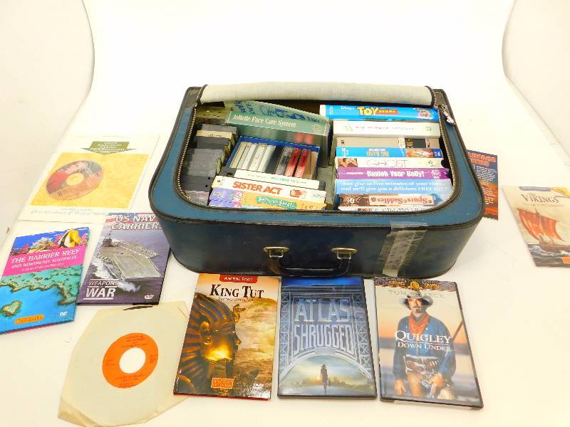 Suitcase Full of VHS Tapes and DVDs