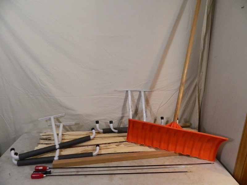 lot 64 image: Gun Cleaning Rods, Ceiling Hanging Organizer, and More