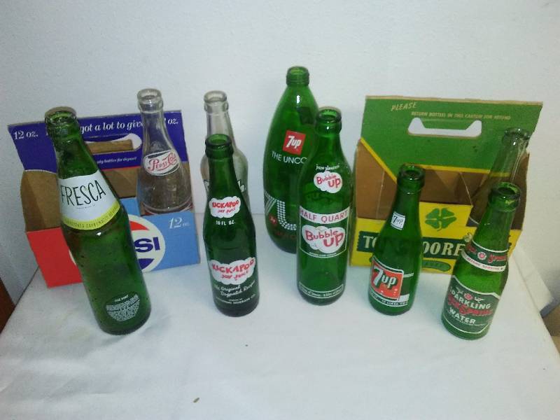 lot 123 image: Vintage Soda and water bottles (9) Pepsi, Kickapoo Joy Juice, 7-Up, Bubble Up and more