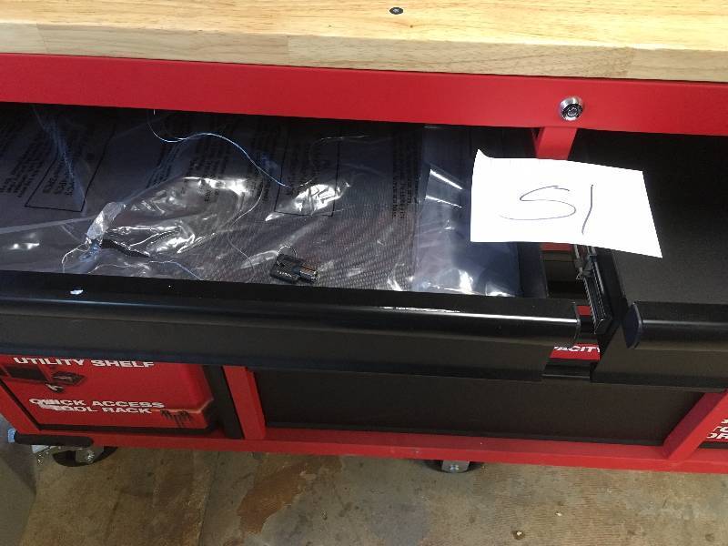 Milwaukee  60.125 in. 11-Drawer and 1-Door 22 in. D Mobile Workbench with Sliding Pegboard Back Wall, Red and Black whit small damage on the center and side