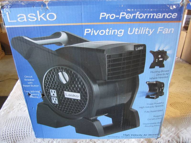 lot 239 image: Lasko Pivoting Utility Fan Open Box...