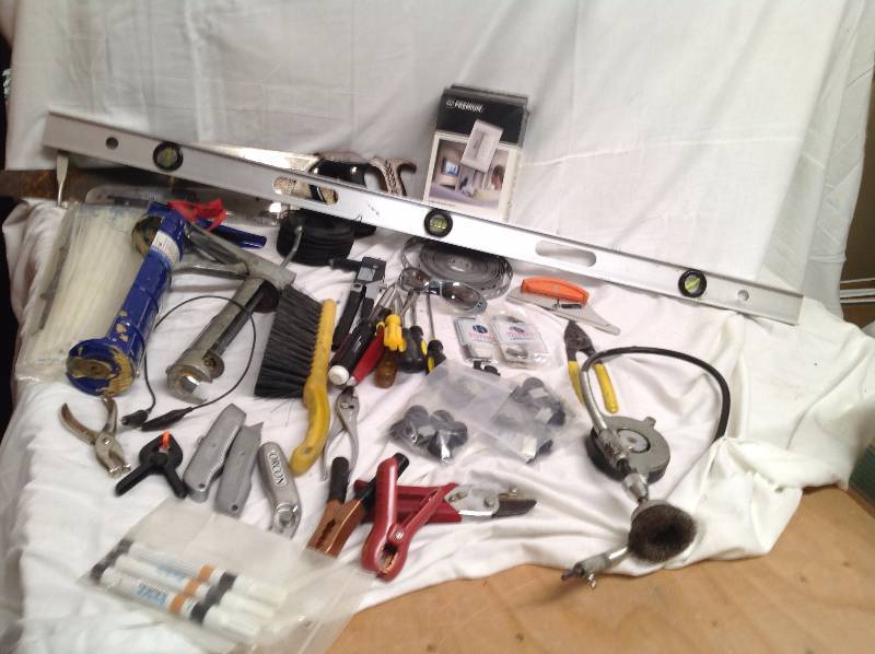 lot 12 image: Tools- 4 Foot Level, Pop Rivet Tool, Screwdrivers, Small and Large Calking Guns, Cutters, Pliers, Pipe Cutter, Wire Cutters