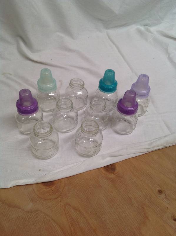 lot 56 image: 10- Small Glass Baby Bottles
