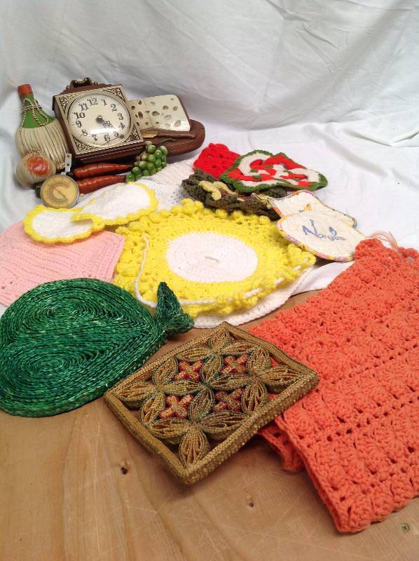 lot 74 image: Kitchen Crochet items pot holders, towels vintage clock.