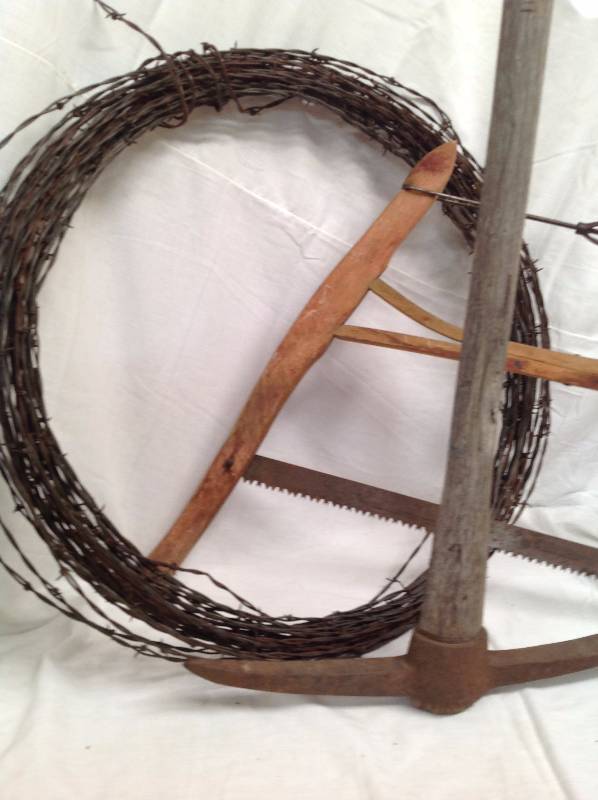 lot 76 image: Barb Wire and vintage Tree Saw and Pick Ax