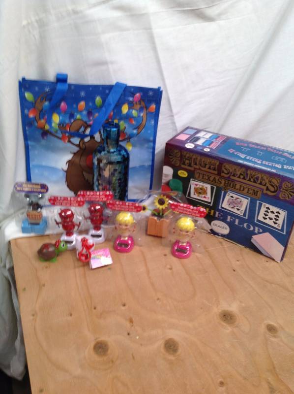 lot 89 image: Solar Power Toys, Hello Kitty, Reindeer Bag, and Texas Holdem