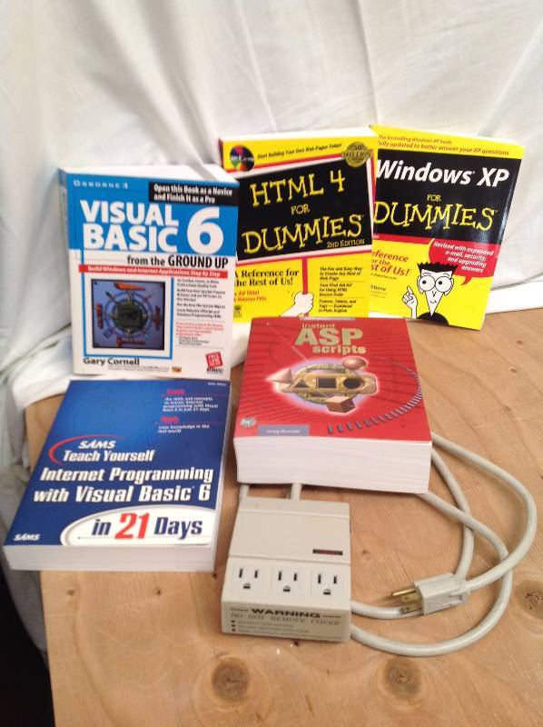lot 91 image: Serge Protector and Five Soft Cover Computer Books
