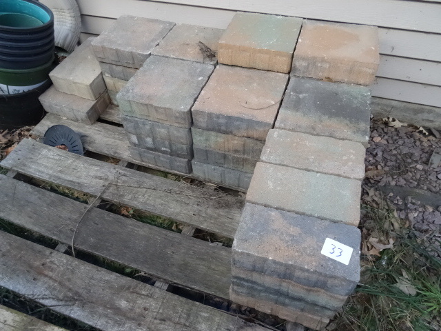lot 33 image: Concrete pavers. 44 pieces. 2 sizes...