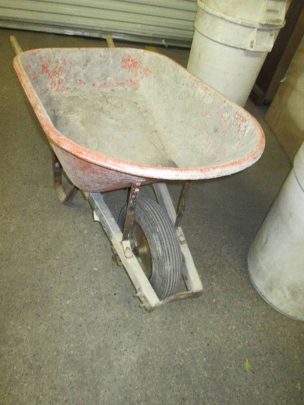 lot 38 image: orange wheel barrow crack in one si...