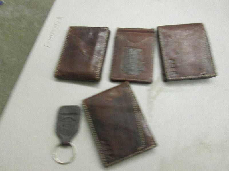 lot 81 image: 4 canyon leather wallets and a leat...