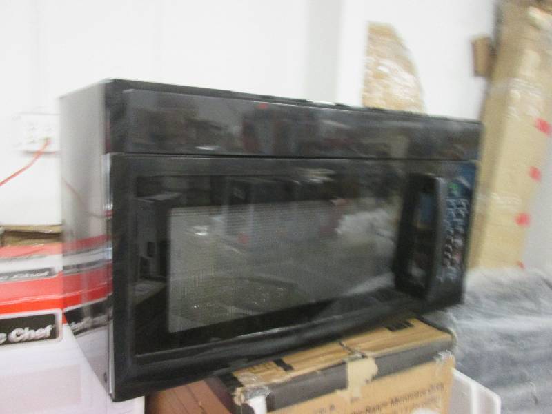 lot 206 image: black over the range microwave test...
