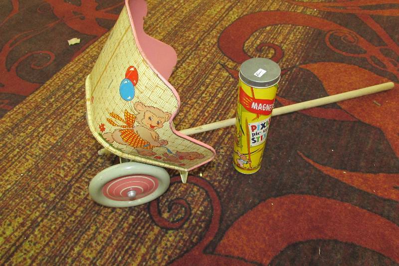 lot 263 image: VINTAGE DOLL STROLLER AND PIXIE PIC UP STICKS