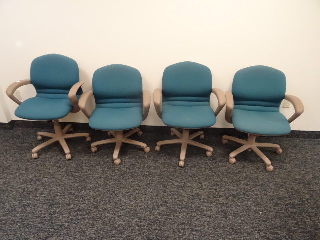 4 matching office chairs on wheels....