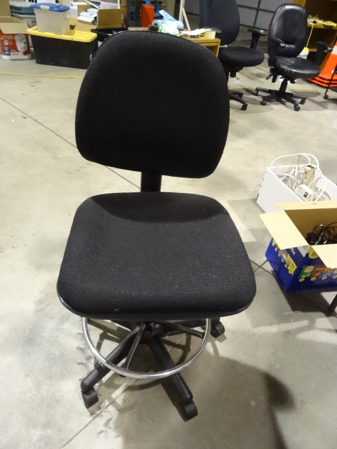 Adjustable height stool on wheels. ...
