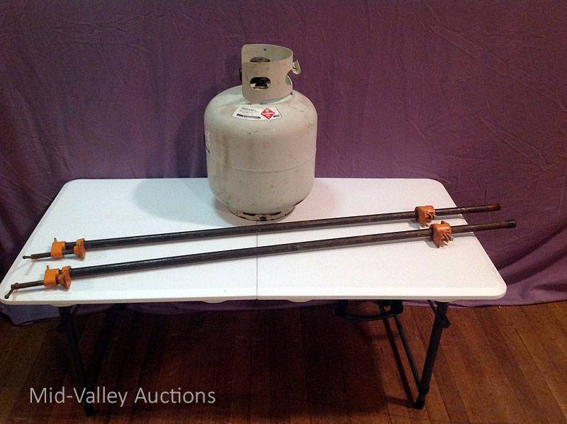 lot 63 image: Propane Tank & Pipe Clamps
