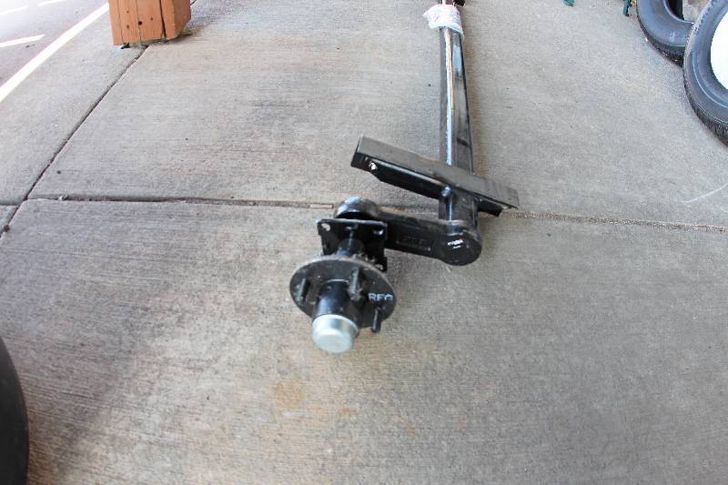 lot 0008 image: New Pop Up Camper Style Axle 2200 lbs - 4 bolt hub flanges.