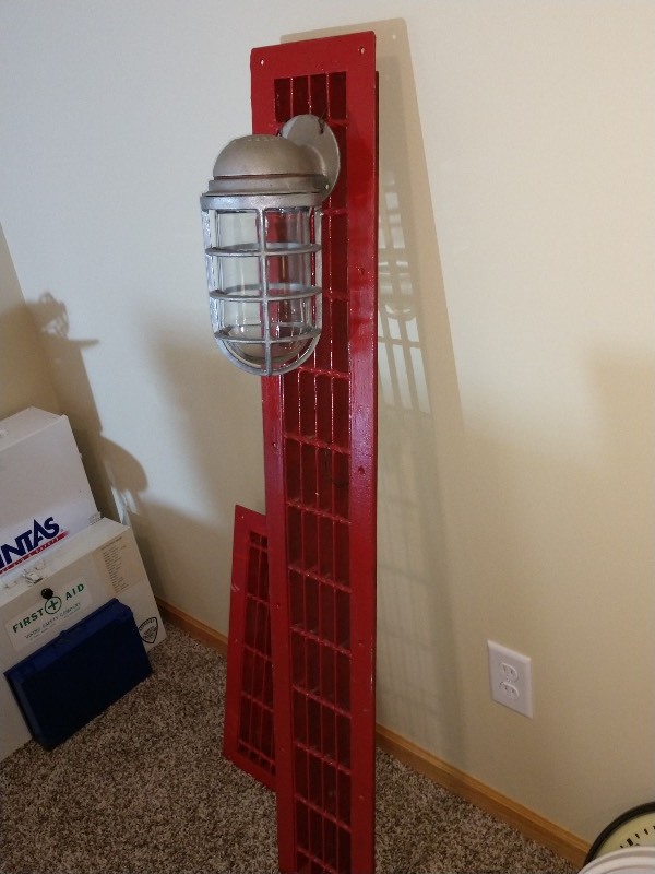lot 26 image: Heavy Duty Vintage Floor Grates with One Explosion Proof Caged Light