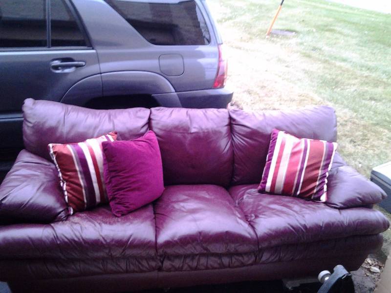 lot 3 image: Burgundy Couch With Decorative Pillows 84