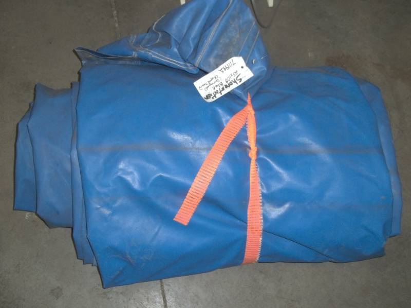lot 119 image: Blue Wood Pile tarp may have some cuts or holes