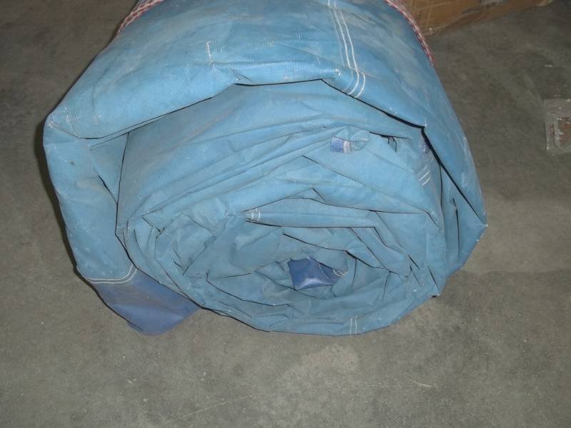 lot 123 image: Blue Wood Pile tarp may have some cuts or holes