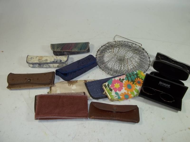 lot 141 image: Glasses, clip-on sunglasses and wire basket