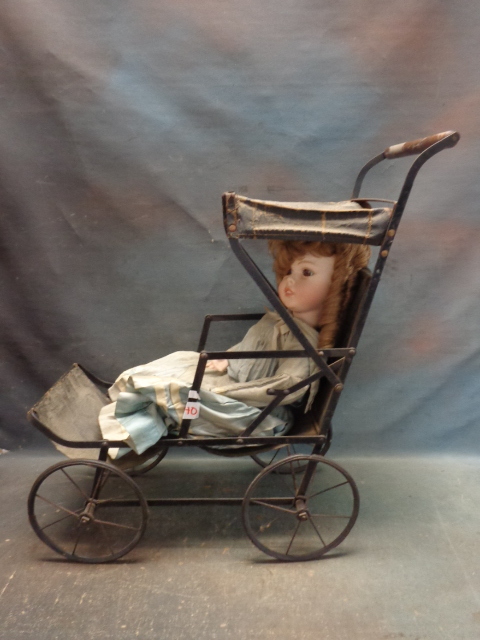 lot 40 image: Porcelain Doll in Metal Stroller