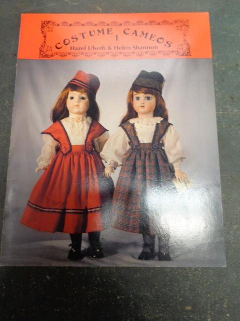 lot 42 image: Doll Wigs and Books