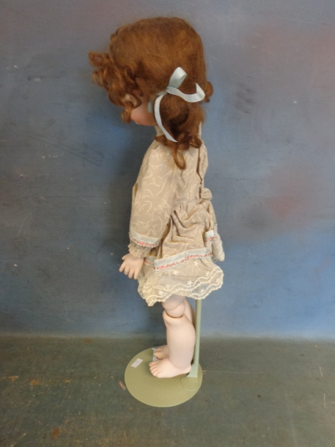 lot 100 image: Porcelain Doll