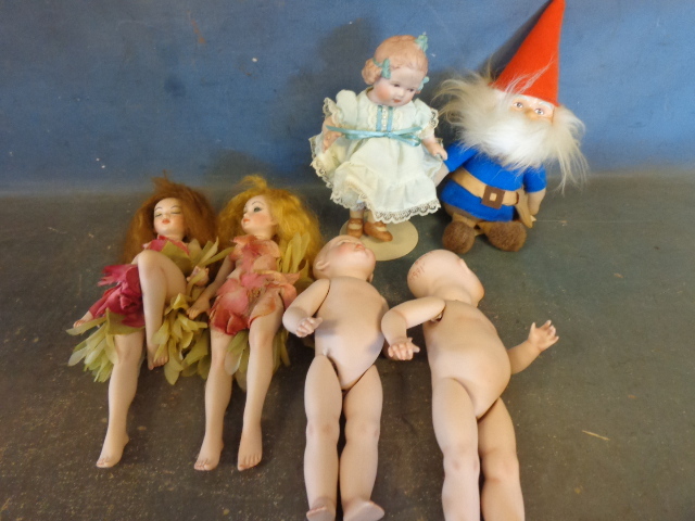 lot 82 image: Porcelain Dolls, Fairys and a Gnome