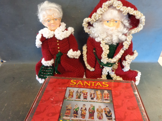 lot 181 image: Crocheted Mr & Mrs Santa and Ceramic Santas
