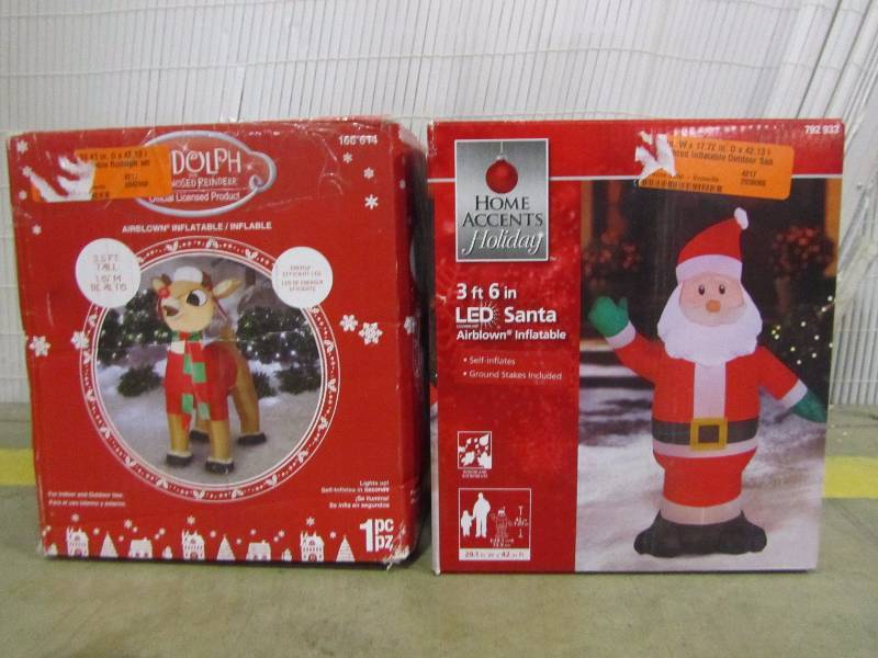 lot 6 image: Home Accents Holiday  Lighted Inflatable Rudolph with Winter Wear & Lighted Inflatable Outdoor Santa